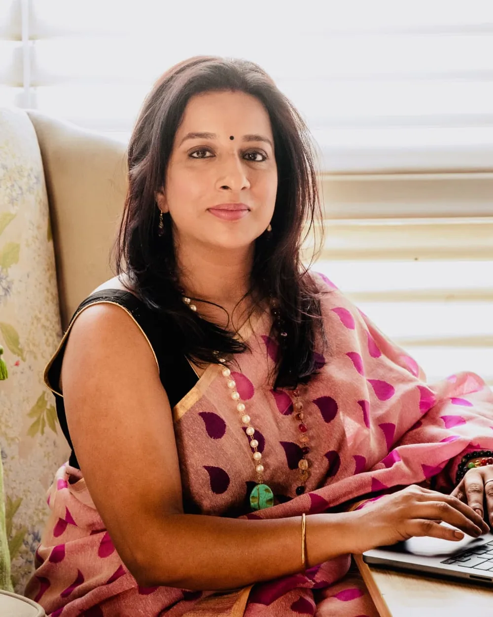Coach Swapnila Rai working at her desk